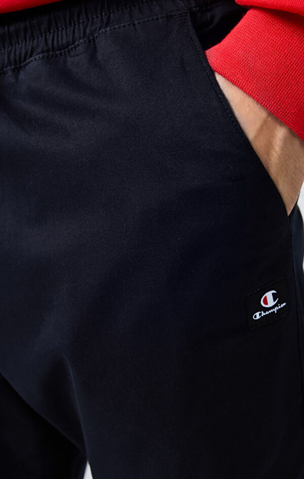 Champion -Pantalon à revers élastiques pour librairie – Noir